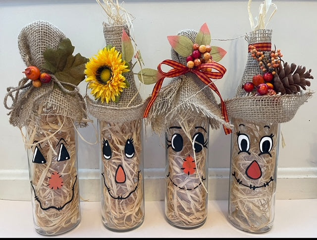 Fall scarecrow lighted wine bottle